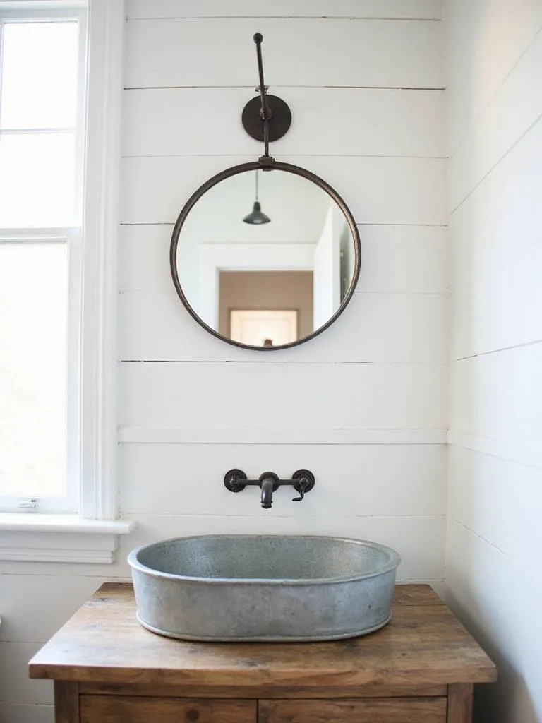 Farmhouse bathroom vanity with galvanized metal sink and mirror.