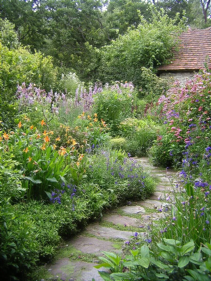 High-quality ergonomic gardening tools arranged on a wooden bench in a garden setting showcasing angled handles and cushioned grips